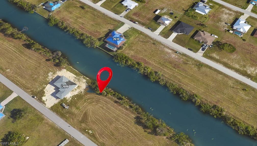 View of property location with a large body of water