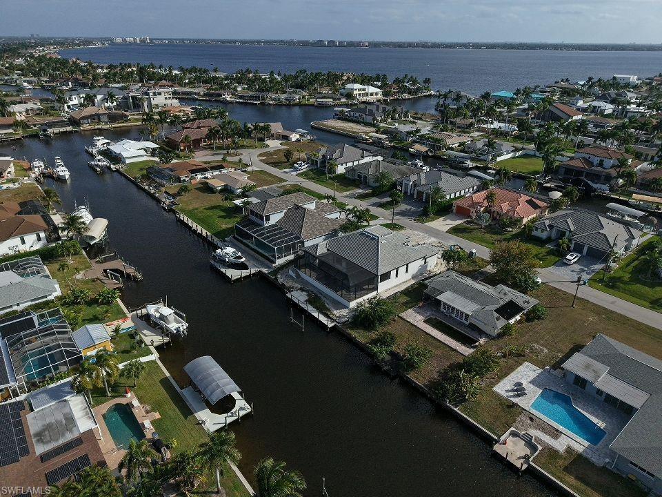 View of property location with nearby suburban area and a nearby body of water