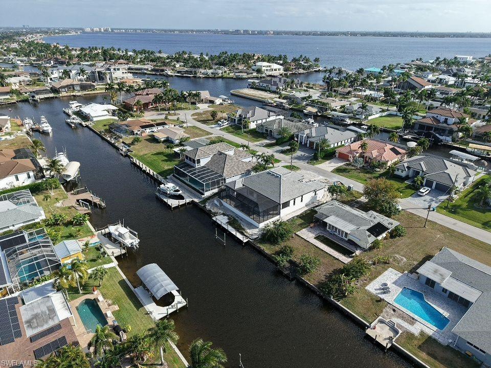View of property location featuring nearby suburban area and a nearby body of water