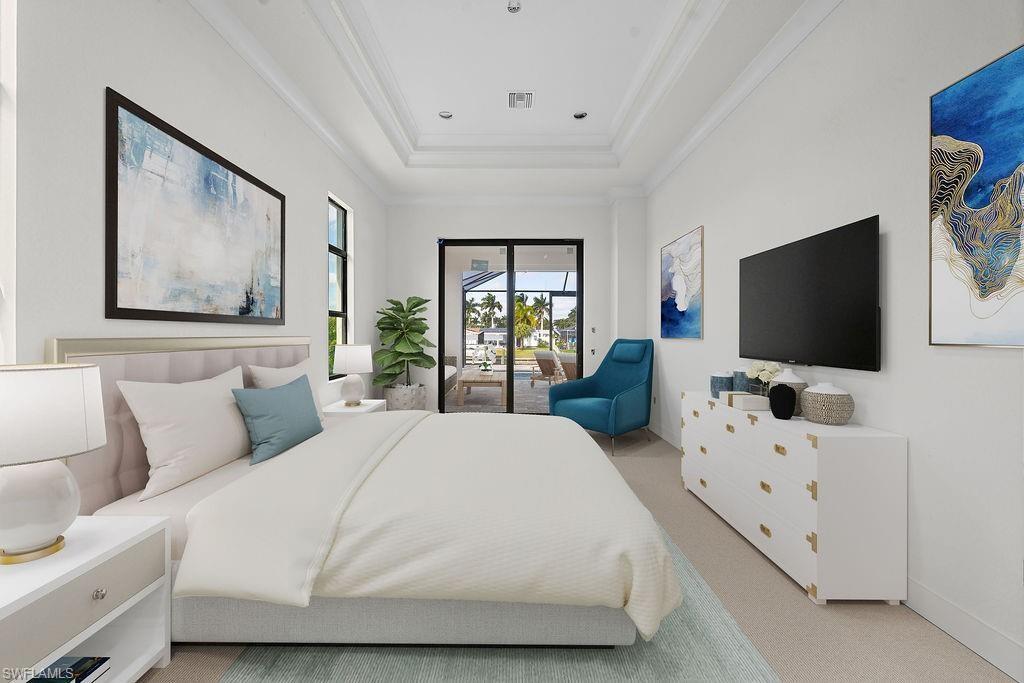 Bedroom with access to outside, a raised ceiling, carpet flooring, and ornamental molding