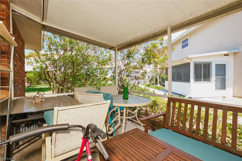 Wooden deck featuring outdoor dining area