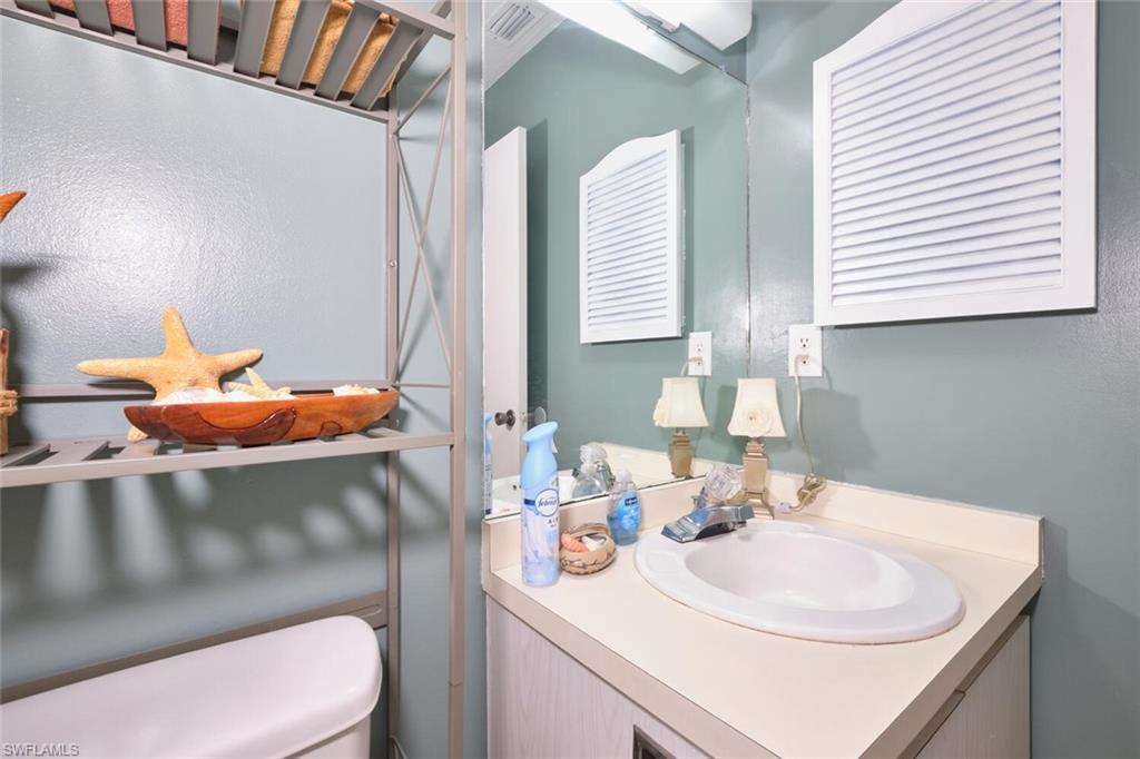 Half bath with vanity and toilet