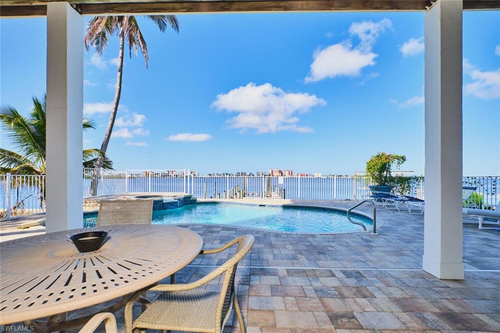 First floor View of swimming pool with a patio area and a pool with connected hot tub