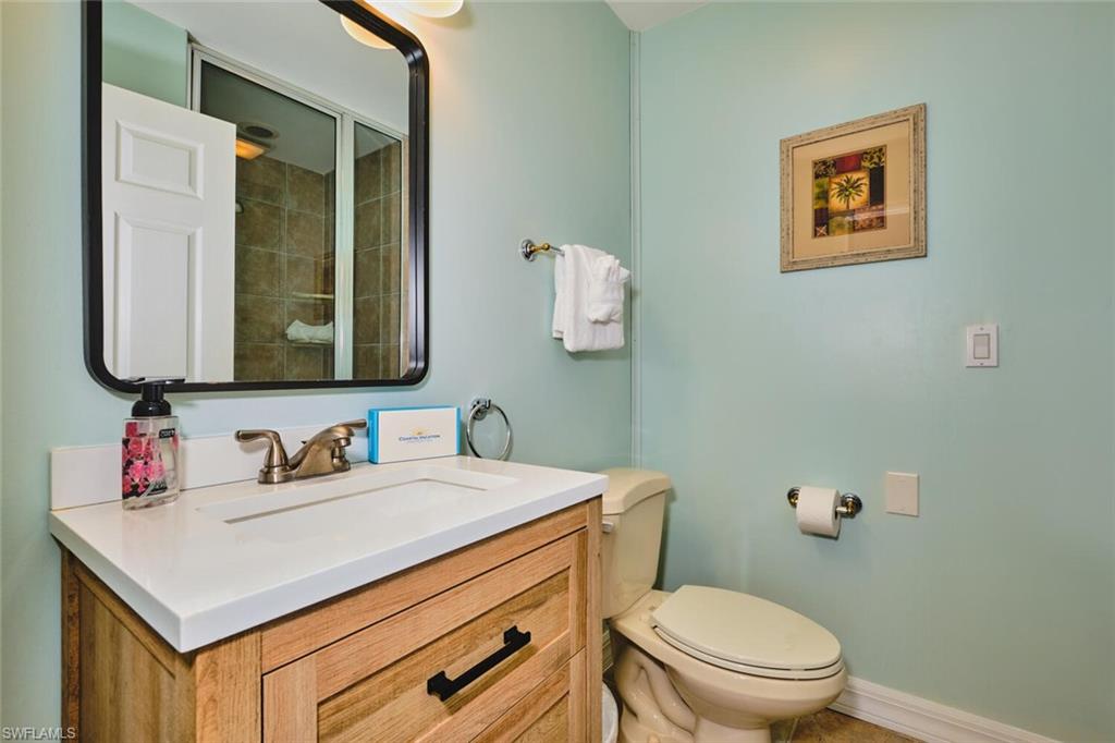 Full bathroom featuring vanity and toilet