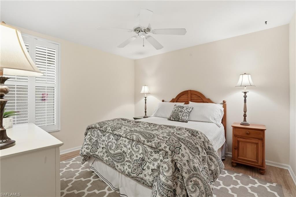 Bedroom with a ceiling fan and light wood finished floors
