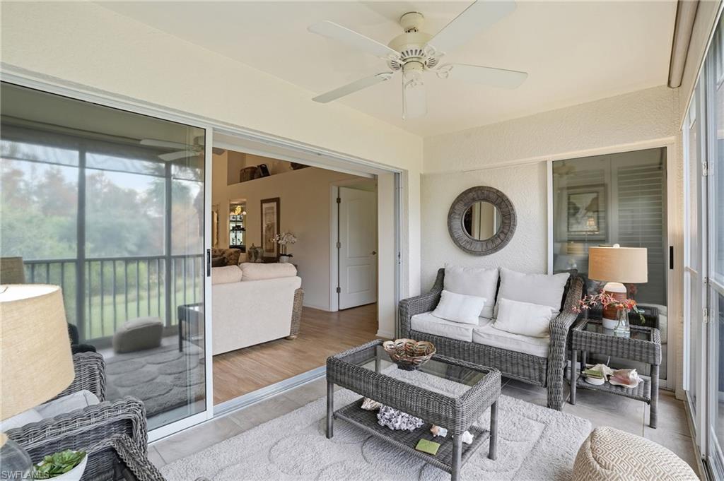 Sunroom featuring an indoor / outdoor hangout area with view of golf course