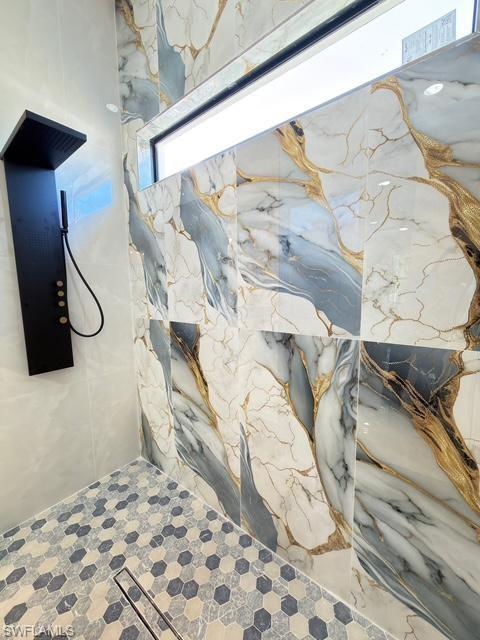 Bathroom view of a marble finish shower