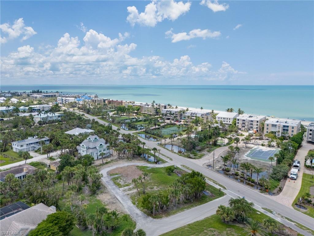 Aerial overview of property's location with a large body of water