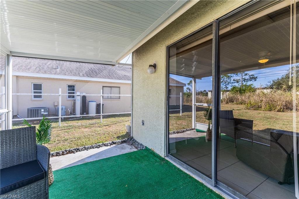 Sunroom with plenty of natural light and a patio area