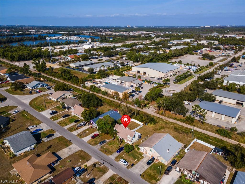 View of property location with nearby suburban area and a nearby body of water