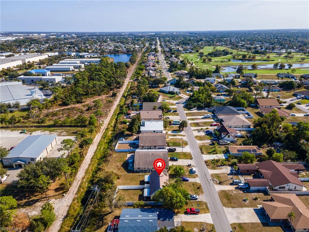 Aerial view of residential area with a large body of water