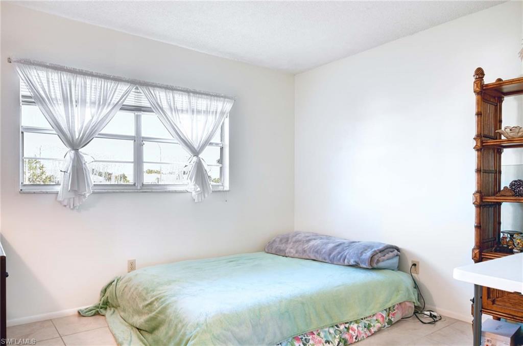 Bedroom featuring light tile patterned floors
