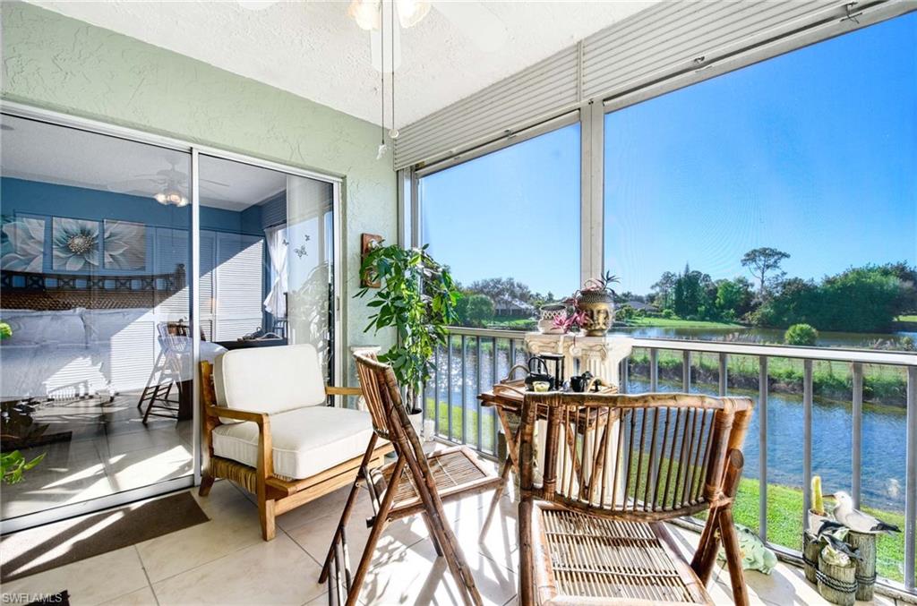 Sunroom with a water view