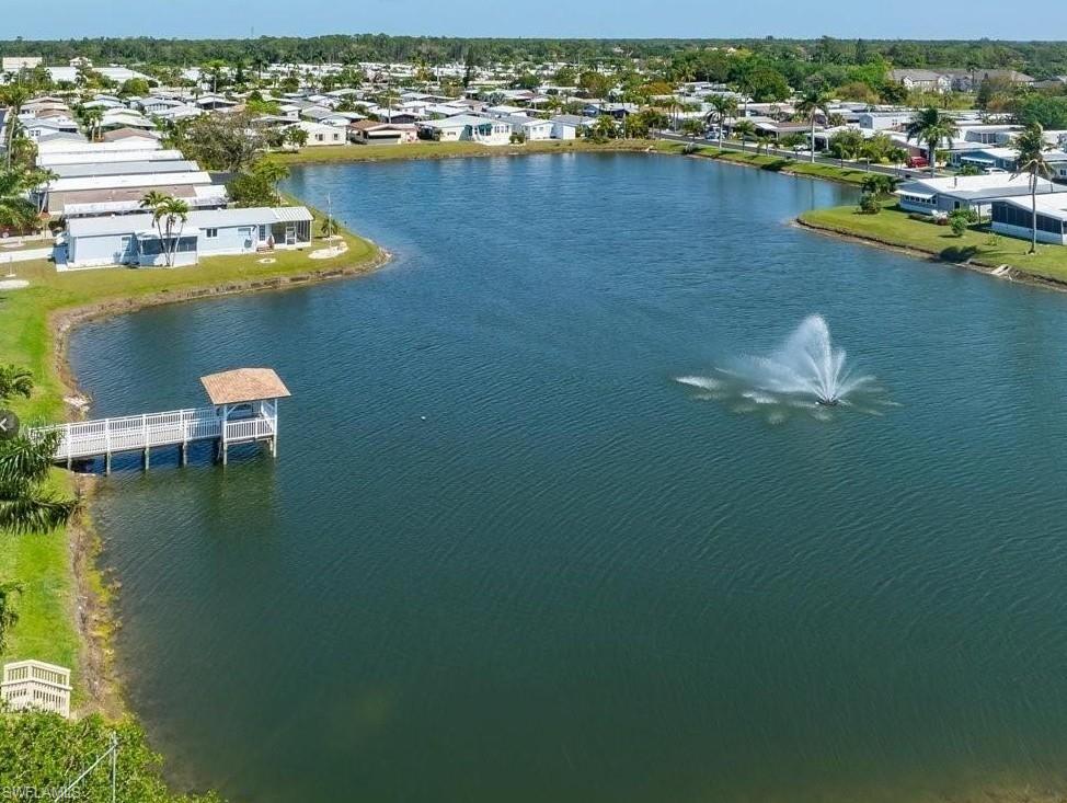 Aerial perspective of suburban area with a large body of water