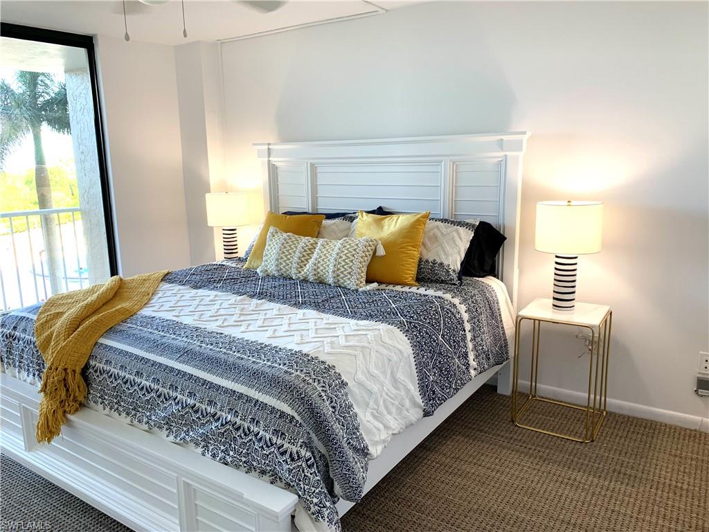 Bedroom with carpet floors and access to exterior