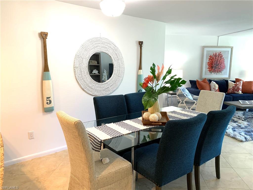 Dining area featuring light tile patterned floors