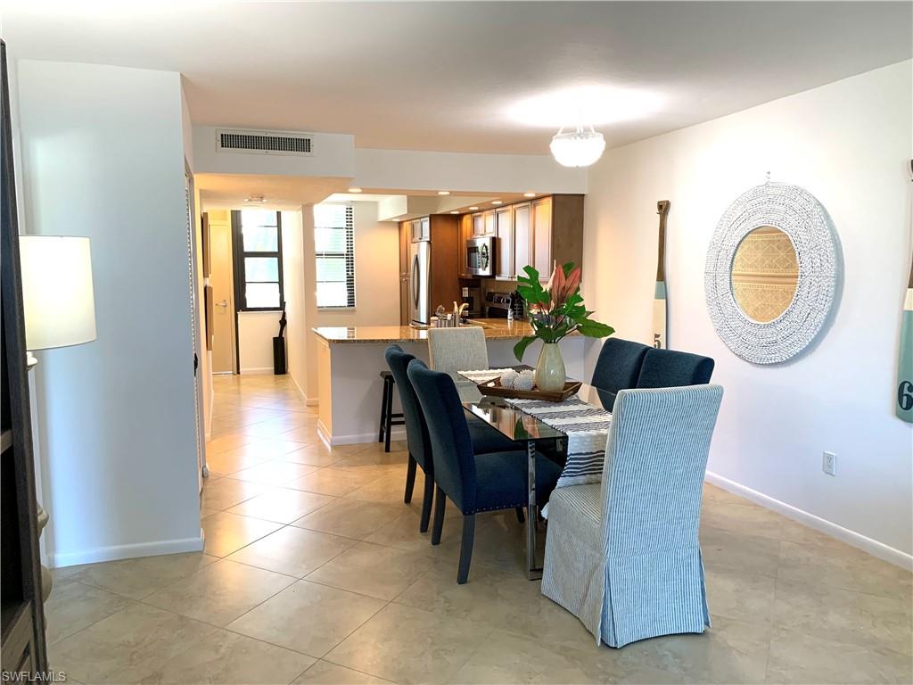 Dining area featuring light tile patterned flooring
