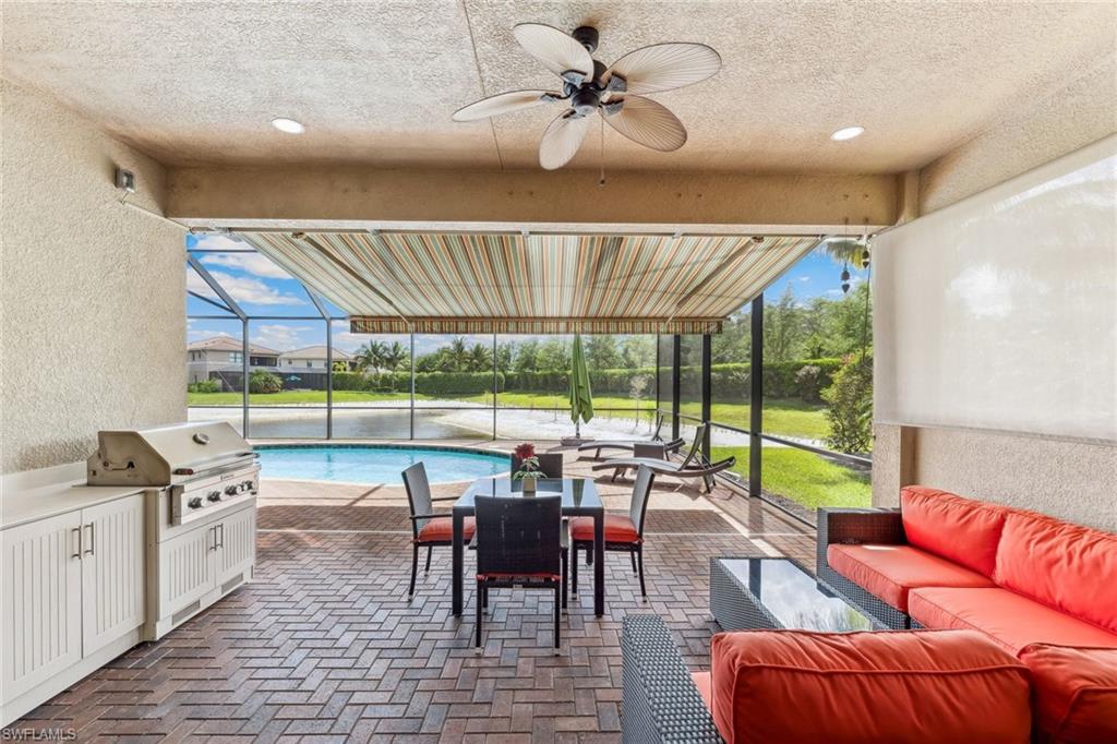 Covered outdoor lanai space with outdoor kitchen