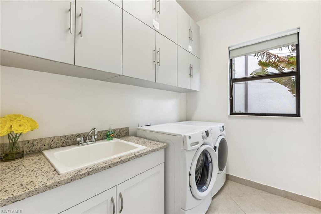 1st floor laundry room with extra storage room under staircase
