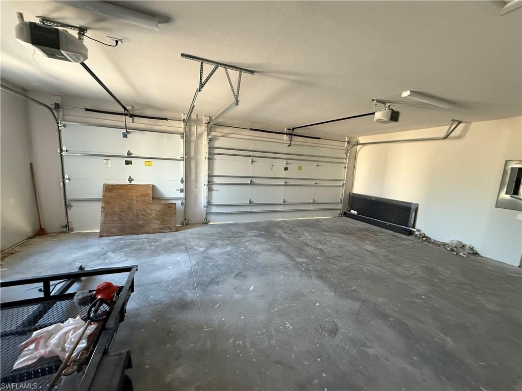 Garage featuring a garage door opener