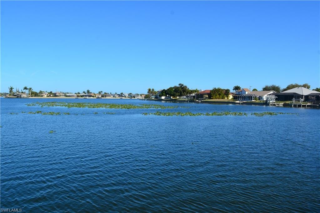 Water view featuring nearby suburban area