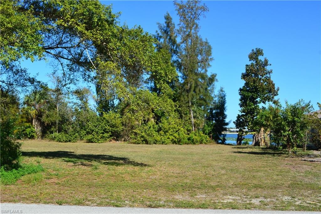 View of green lawn with a water view