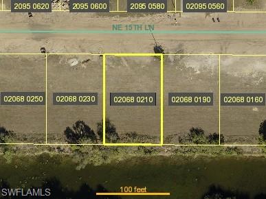 Aerial overview of property's location with property parcel outlined