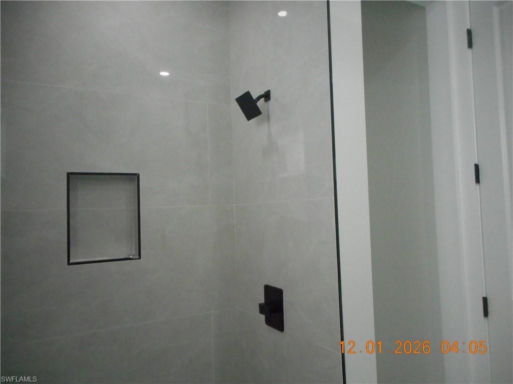 Full bath with tiled shower