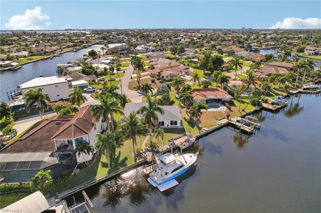 Aerial perspective of suburban area with a nearby body of water