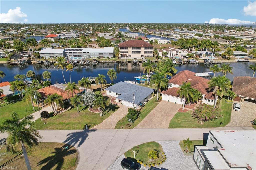 Aerial perspective of suburban area with a large body of water