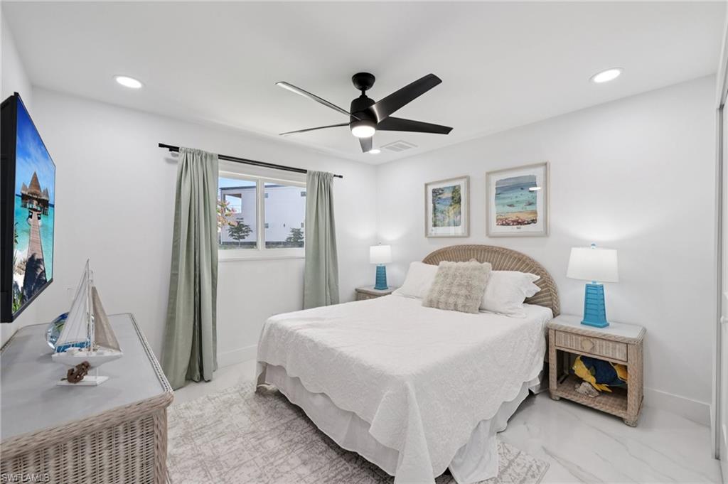 Bedroom featuring a ceiling fan and recessed lighting