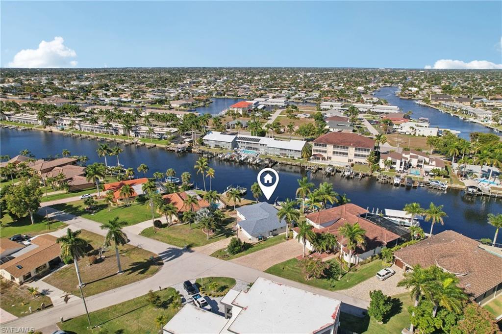 Aerial view of residential area with a nearby body of water