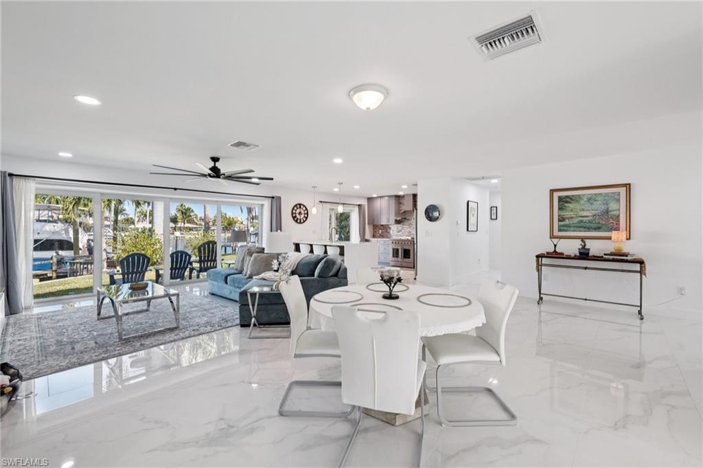 Dining room featuring recessed lighting, light marble finish flooring, and ceiling fan