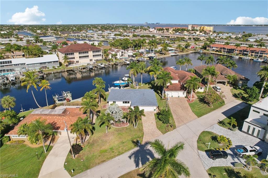 Aerial perspective of suburban area with a nearby body of water