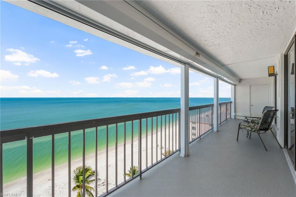 Expansive balcony runs the length of living room and primary suite.
