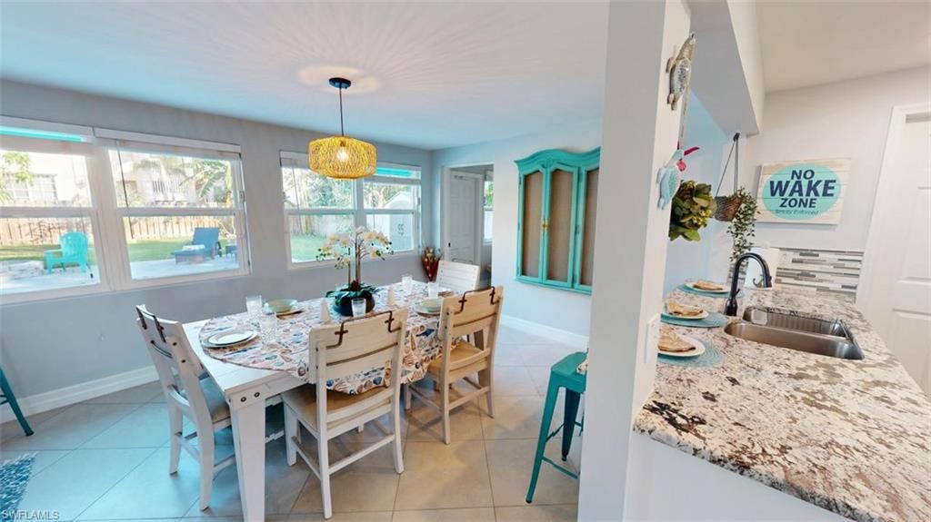 Dining room with light tile patterned floors