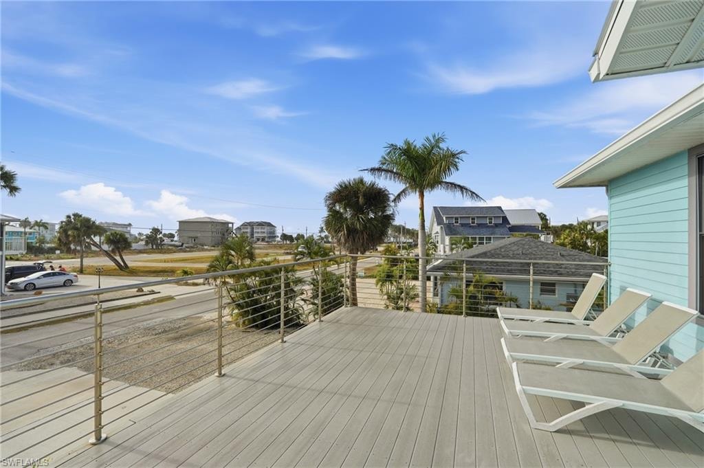 Wooden terrace featuring a residential view - Virtually Edited Image