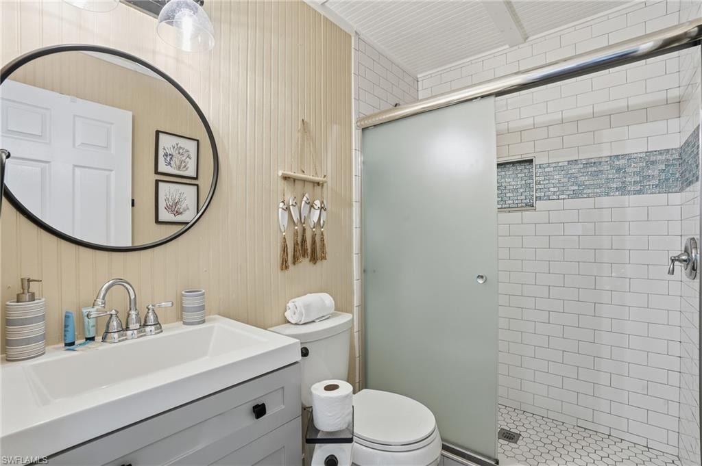Full bathroom with a stall shower and vanity - Virtually Edited Image