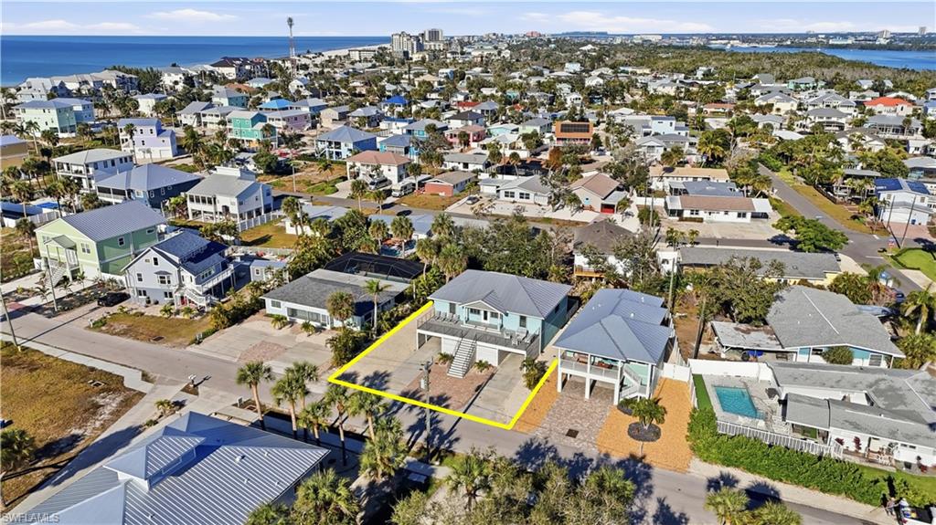 Aerial view of residential area with a large body of water
