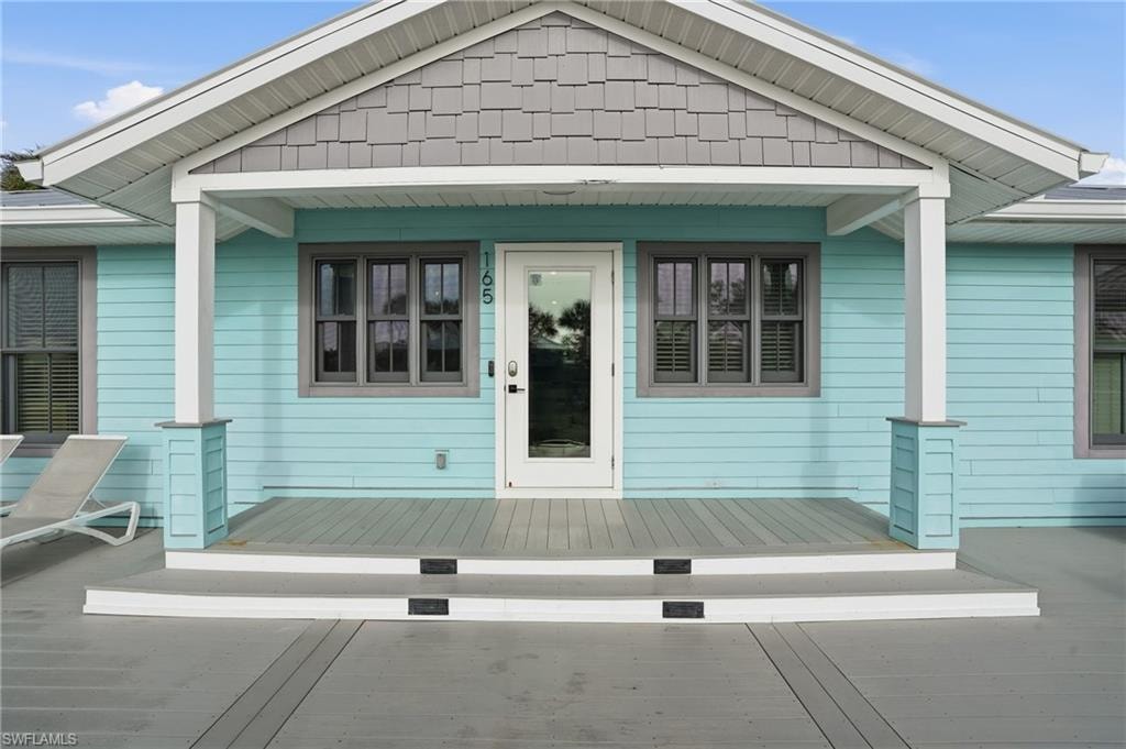 Entrance to property with a deck - Virtually Edited Image