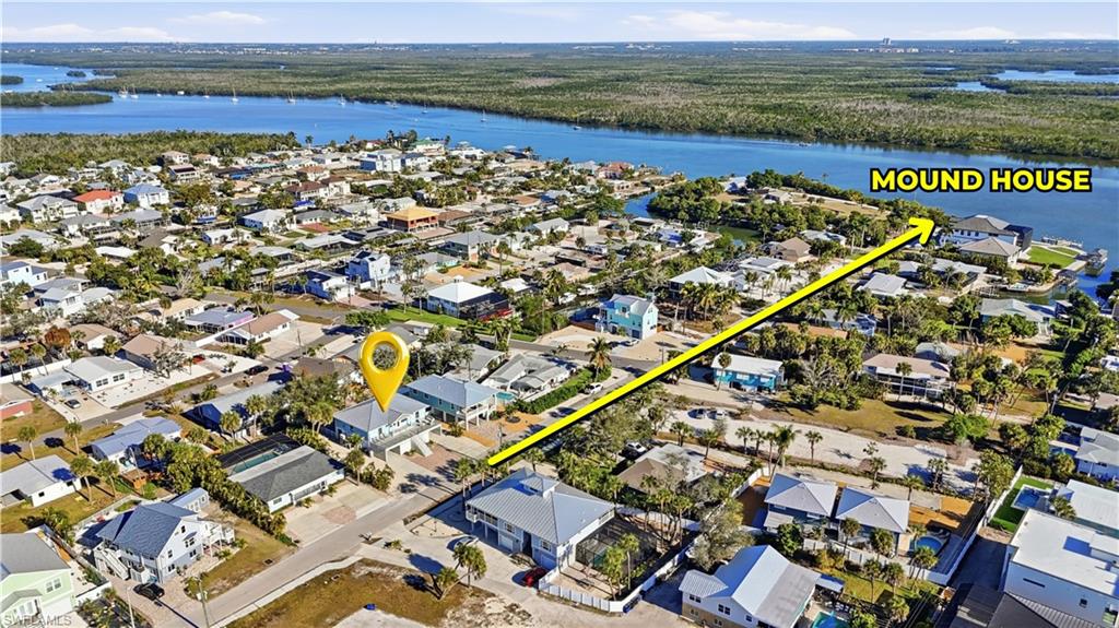 View of property location with nearby suburban area and a large body of water