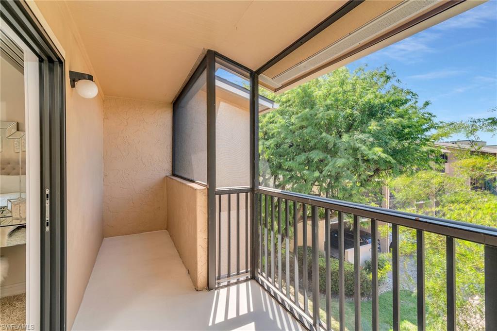 Balcony featuring a sunroom