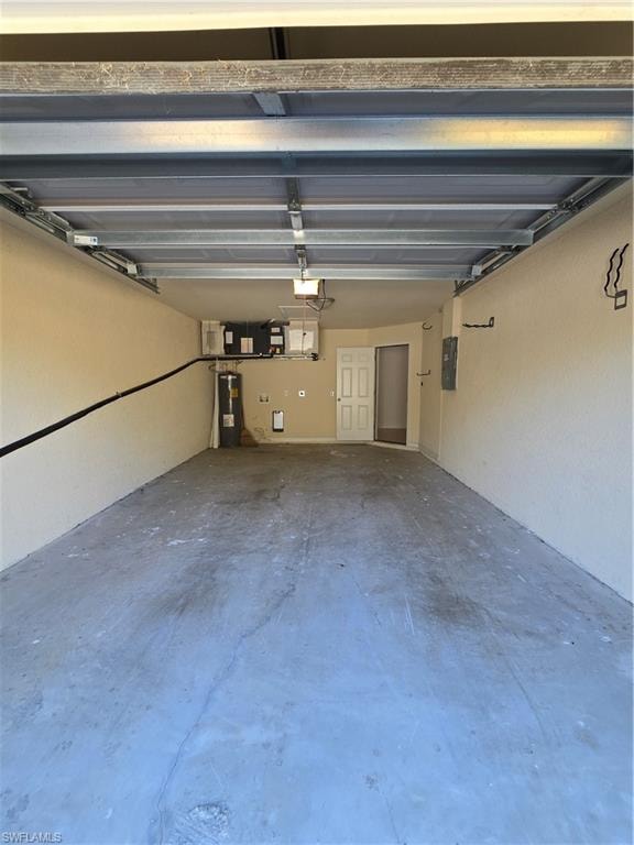 Garage with water heater and electric panel
