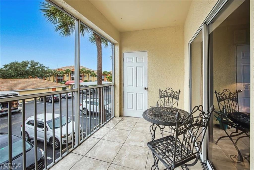 Balcony featuring a sunroom