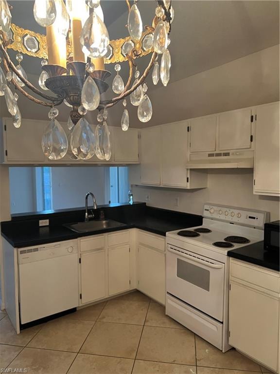 Kitchen featuring white range, white cabinets, dishwasher, and dark countertops