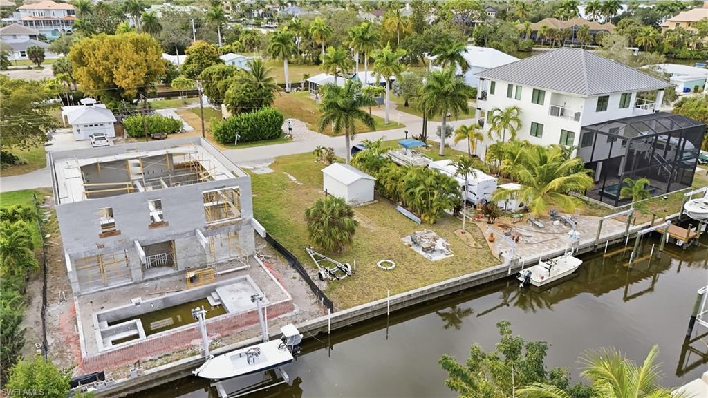 Aerial view of residential area featuring a large body of water