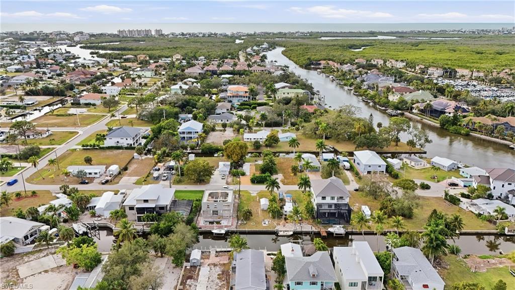 View of property location featuring nearby suburban area and a large body of water