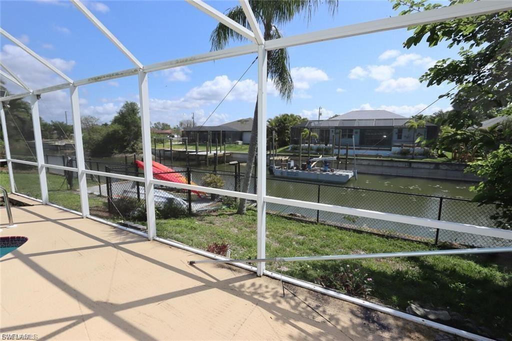Unfurnished sunroom with a water view and plenty of natural light