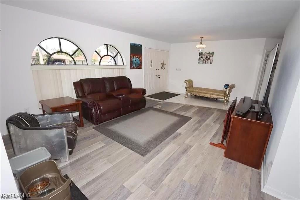 Living room with light wood-type flooring