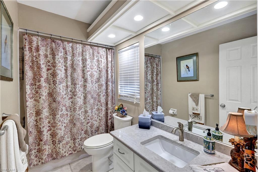 Guest Bathrm w/updated cabinetry, sink and Cambria.  Tub/Shower combo